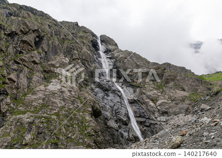 Midagrabin waterfalls cascading down rocky cliffs in the Caucasus Mountains Midagrabin waterfalls cascading down rocky cliffs in the Caucasus Mountains 140217640