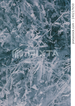 Abstract cracked winter ice texture on Lake Baikal surface, natural background Abstract cracked winter ice texture on Lake Baikal surface, natural background 140217650