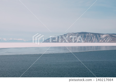 Winter landscape of Lake Baikal and Angara River with ice and mountains 140217664