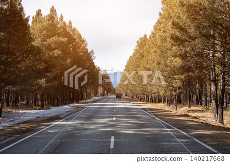 Straight forest road to Arshan with distant mountains, Siberia travel landscape Straight forest road to Arshan with distant mountains, Siberia travel landscape 140217668