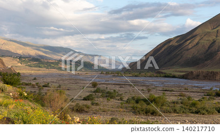 Mountain river valley landscape near Kavalar village with dramatic clouds, Dagestan 140217710