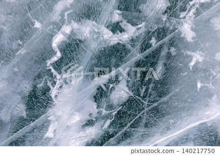 Abstract cracked ice texture on Lake Baikal in winter, natural frozen pattern Abstract cracked ice texture on Lake Baikal in winter, natural frozen pattern 140217750