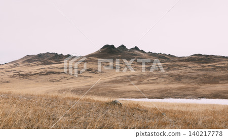 Autumn steppe landscape on Olkhon Island with hills near Lake Baikal Autumn steppe landscape on Olkhon Island with hills near Lake Baikal 140217778