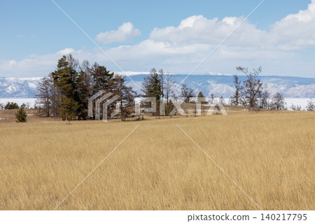 Spring steppe landscape near Cape Kharantsy on Lake Baikal with mountains Spring steppe landscape near Cape Kharantsy on Lake Baikal with mountains 140217795