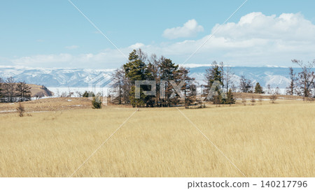 Spring steppe landscape at Cape Kharantsy on Lake Baikal with mountains Spring steppe landscape at Cape Kharantsy on Lake Baikal with mountains 140217796