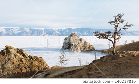 Shaman Rock on frozen Lake Baikal near Khuzhir village, Olkhon Island Shaman Rock on frozen Lake Baikal near Khuzhir village, Olkhon Island 140217810
