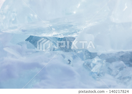Abstract winter ice texture on Lake Baikal with blue frozen cracks and bubbles 140217824