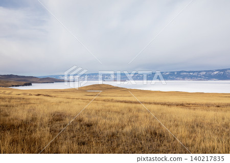 Panoramic steppe landscape and frozen Lake Baikal shoreline on Olkhon Island 140217835