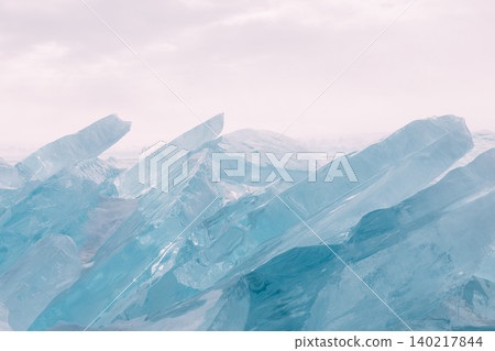 Turquoise ice hummocks on frozen Lake Baikal shoreline in winter daylight 140217844