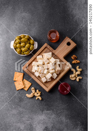 White feta, tofu, or mozzarella cheese cubes with herbs. White mozzarella cheese White feta, tofu, or mozzarella cheese cubes with herbs. White mozzarella cheese 140217890