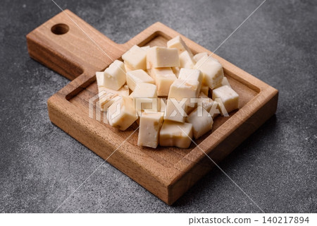 White feta, tofu, or mozzarella cheese cubes with herbs. White mozzarella cheese White feta, tofu, or mozzarella cheese cubes with herbs. White mozzarella cheese 140217894