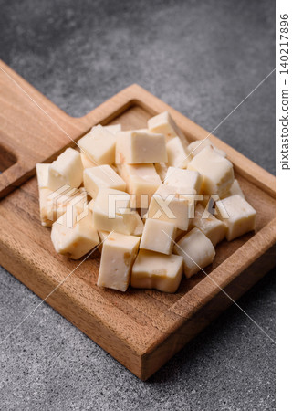 White feta, tofu, or mozzarella cheese cubes with herbs. White mozzarella cheese White feta, tofu, or mozzarella cheese cubes with herbs. White mozzarella cheese 140217896