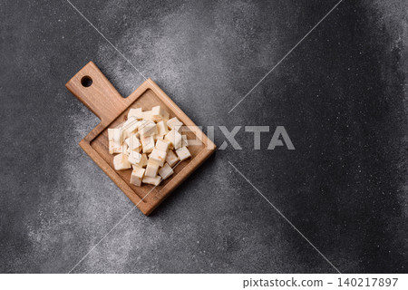 White feta, tofu, or mozzarella cheese cubes with herbs. White mozzarella cheese White feta, tofu, or mozzarella cheese cubes with herbs. White mozzarella cheese 140217897