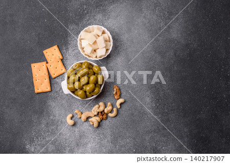 Whole green olives without pits in a bowl as an ingredient for cooking at home. Green olives 140217907