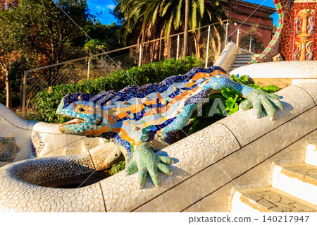 Multicolored mosaic dragon salamander of Gaudi in Park Guell, Barcelona, Spain 140217947