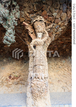 Stone sculpture of a woman on a column in park Guell in Barcelona, Spain 140217951