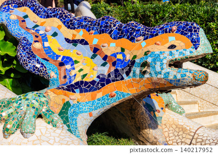 Multicolored mosaic dragon salamander of Gaudi in Park Guell, Barcelona, Spain 140217952