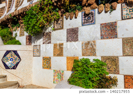 Mosaic wall by Antoni Gaudi in the Park Guell in Barcelona, Catalonia, Spain Mosaic wall by Antoni Gaudi in the Park Guell in Barcelona, Catalonia, Spain 140217955