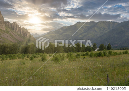 Summer sunrise over green valley and mountains in Altai Republic landscape Summer sunrise over green valley and mountains in Altai Republic landscape 140218005