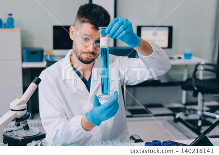 Lab technician experimenting in lab 140218141