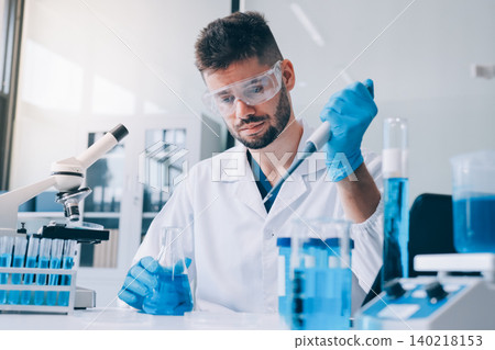 Lab technician experimenting in lab Lab technician experimenting in lab 140218153