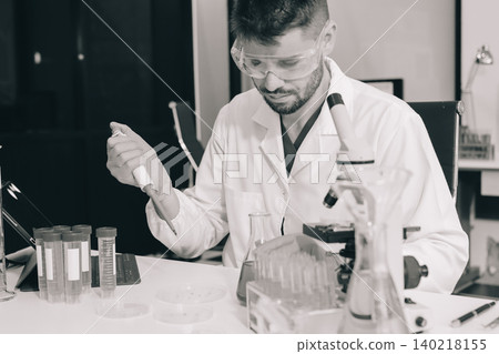 Lab technician experimenting in lab Lab technician experimenting in lab 140218155