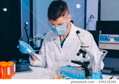 Lab technician experimenting in lab Lab technician experimenting in lab 140218166
