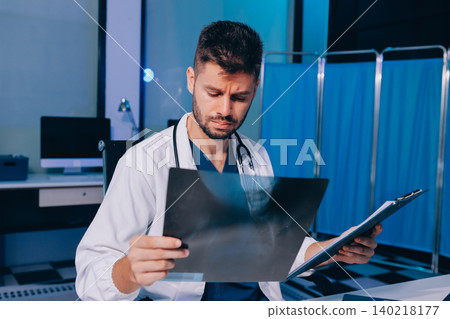 Man, doctor and laptop typing in healthcare research, communication or social media at office desk. Male medical expert working on computer in online search, browsing or chatting on tablet at clinic Man, doctor and laptop typing in healthcare research, communication or social media at office desk. Male medical expert working on computer in online search, browsing or chatting on tablet at clinic 140218177