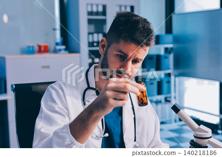 Attractive student of chemistry working in laboratory 140218186