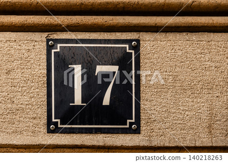 House Number 17 Sign on Stone Building Facade House Number 17 Sign on Stone Building Facade 140218263