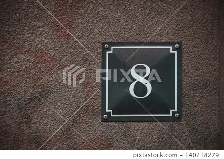 Vintage House Number 8 Sign on Weathered Textured Wall, Classic Address Plaque with Copy Space Vintage House Number 8 Sign on Weathered Textured Wall, Classic Address Plaque with Copy Space 140218279