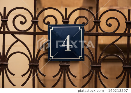 Classic House Number 4 Sign on Ornamental Wrought Iron Fence, Elegant Address Plaque Classic House Number 4 Sign on Ornamental Wrought Iron Fence, Elegant Address Plaque 140218297