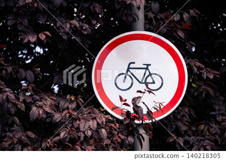 Bicycle Traffic Sign on Urban Street Pole Against Blue Sky Bicycle Traffic Sign on Urban Street Pole Against Blue Sky 140218305
