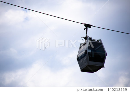 Modern Cable Car Cabin Suspended on Aerial Ropeway Modern Cable Car Cabin Suspended on Aerial Ropeway 140218339