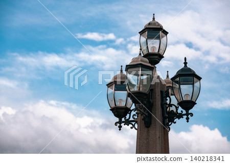 Vintage Ornate Street Lamp Against Dramatic Cloudy Sky Vintage Ornate Street Lamp Against Dramatic Cloudy Sky 140218341