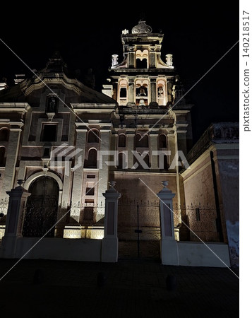 Cordoba, Argentina - April 10, 2026: Landmark cathedral illuminated in Plaza San Martin 140218517