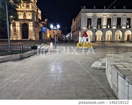 Cordoba, Argentina - April 10, 2026: AMO CBA sign and Cabildo building at night Cordoba, Argentina - April 10, 2026: AMO CBA sign and Cabildo building at night 140218522