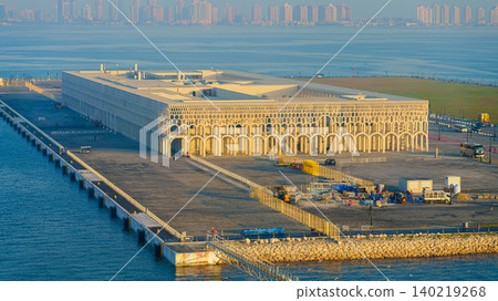 Doha, Qatar - Jan 14 2024, aerial sea view of new cruise terminal of Doha Port, with buildings and skyscrapers on background, at daytime, Doha, Qatar Doha, Qatar - Jan 14 2024, aerial sea view of new cruise terminal of Doha Port, with buildings and skyscrapers on background, at daytime, Doha, Qatar 140219268
