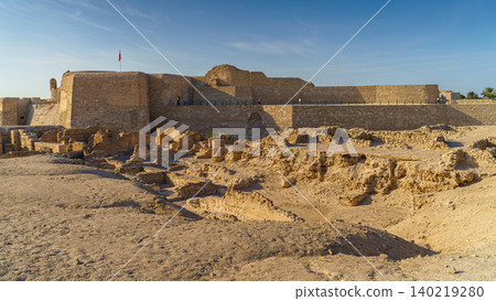 Manama, Bahrain - Jan 15 2024, Panoramic view of the ruins of the ancient fortress of Qalat Al Bahrain, included in the UNESCO World Heritage List, at daytime, Manama, Bahrain  140219280