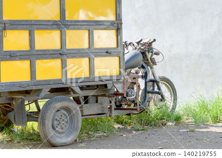yellow vintage bicycle on the street yellow vintage bicycle on the street 140219755