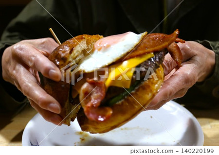 A burger with a meaty patty A burger with a meaty patty 140220199