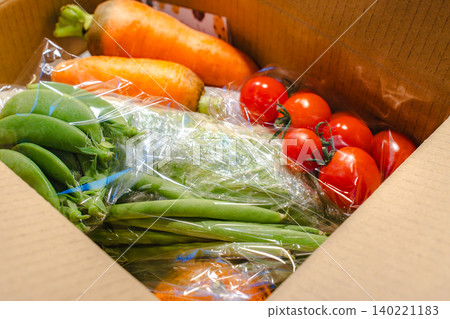Fresh vegetable set delivered directly from the farm, in a cardboard box. 140221183