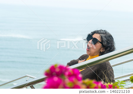 A woman wearing sunglasses A woman wearing sunglasses 140221210