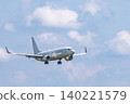 A white passenger plane begins its approach to land. 140221579