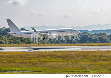 Close-up of a large passenger plane just before landing. Close-up of a large passenger plane just before landing. 140221580