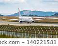 Close-up of a large white passenger plane that has landed. 140221581