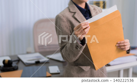 Asian adult business women lawyer reading legal document paper contract corporate office professional workplace business service reviewing agreement Asian adult business women lawyer reading legal document paper contract corporate office professional workplace business service reviewing agreement 140222536