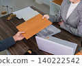 lawyer professional woman passing legal document contract paper to client during consultation meeting at law office desk with justice scales symbol 140222542