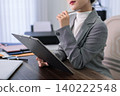 professional Asian lawyer business women holding clipboard document thinking planning legal case strategy consulting client review contract paperwork office 140222548