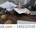 professional lawyer reviewing signing legal contract document with gavel on desk in law office workspace business agreement consultation legal services attorney 140222549